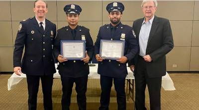Captain Allen Kirmss, commanding officer of the 17th Pct. presented officer of the month to Officers Ramman and Islam, who apprehended a suspect who had robbed a street vendor at knifepoint. Don Reid from the 17th Pct. community council is right.