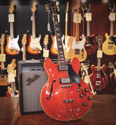 Guitars and a Fender amplifier at Rudy’s Music.