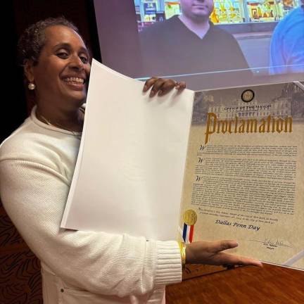 Susan DeCarava Penn with Dallas Penn Day Proclamation signed by Eric Adams.