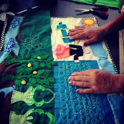 Creating a story-cloth at Common Threads Project. Photo courtesy of Common Threads Project