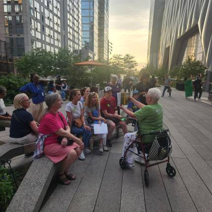 A docent leads a group of visitors on a tour of the High Line earlier this summer.