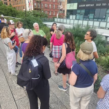 A docent leads a group of visitors on a tour of the High Line earlier this summer.