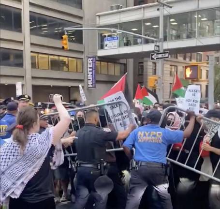 NYPD holds back Park East synagogue protestors at East 67th Street and Lexington Avenue.