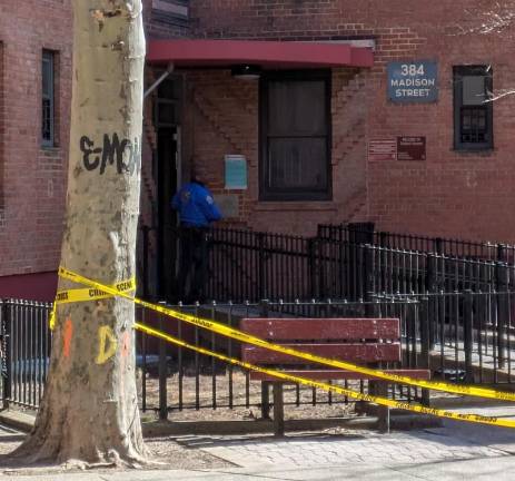 Cops had retreated outside the building at 384 Madison St. on Feb. 18 after a suspect allegedly opened fire on them as they tried to execute a search warrant. After a tense three-hour standoff, a detective and the suspect were both wounded and rushed to Bellevue Hospital.