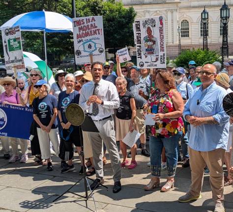 Raylly for retirees, CM Justin Brannan at right in blue shirt.