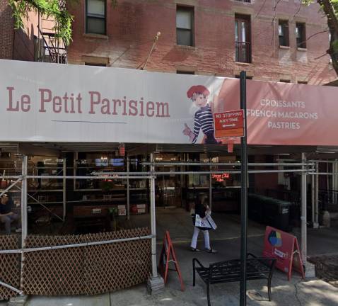 Le Petit Parisien Bakery on East 78th Street completely covered by scaffolding, Aug. 2024.