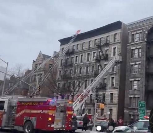 Eighteen people were injured in a fire in Harlem on Feb. 23. One 27 year old male could not revived and died in an area hospital. Firefighters pulled three others to saftey using a daring rope roof rescue to pluck three residents from the fifth floor. Photo: Citizens app