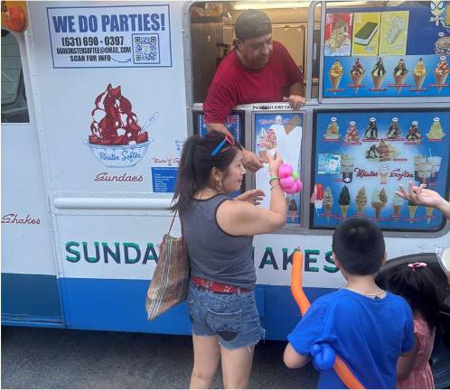 There were two Mr. Softee trucks handing out free ice cream cones at the 13th Pct. National Night Out Against Crime.