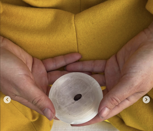 MacEwan held a black turtle bean during their yellow-themed meditation on ambition.