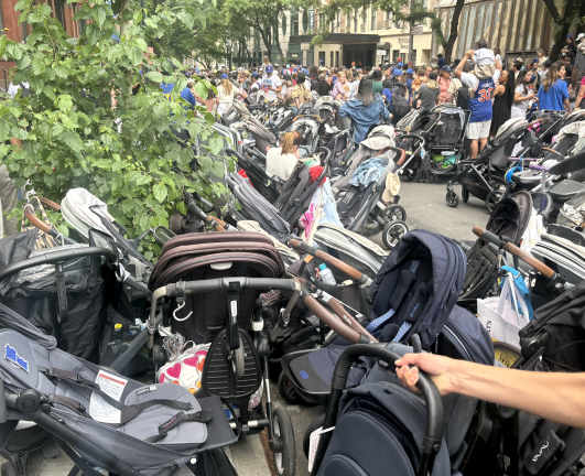Strollers are the primary mode of transport for many of the youngest Knicks fans.