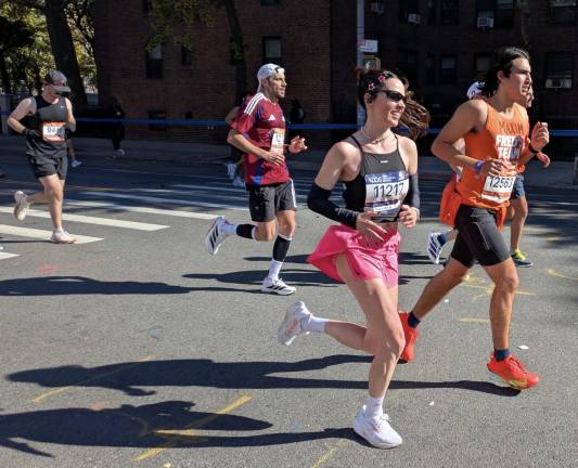 Colors abound in the NYC Marathon, pink and orange included.