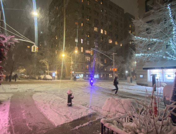 Few ventured out as the blizzard struck NYC on the evening of Feb. 22. A lone pedestrian crosses E. 83rd St and Madison Ave.