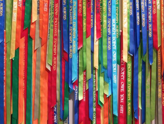 Andrea Bowers' &quot;Political Ribbons&quot; deliberately utilize what she refers to as a &quot;girly&quot; medium to deliver powerful messages. Photo: Adel Gorgy
