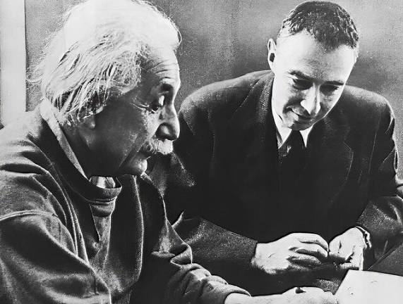 Robert Oppenheimer (right), known as the father of the atom bomb which helped end World War II with Albert Einstein in a posed photo at the Institute for Advanced Studies.