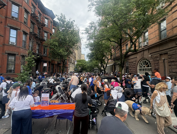 A packed West 83rd Street, even featuring a canine Brunson jersey!