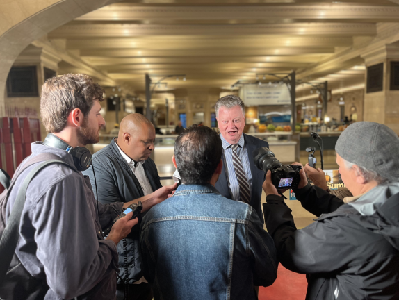 Tracks Grand Central Madison principal owner Bruce Caulfield, center, fields questions after a press conference introducing summer activities at the Grand Central Complex.