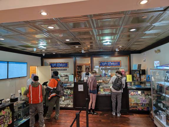 Shoppers chat with Lenox Hill Cannabis Co’s budtenders.
