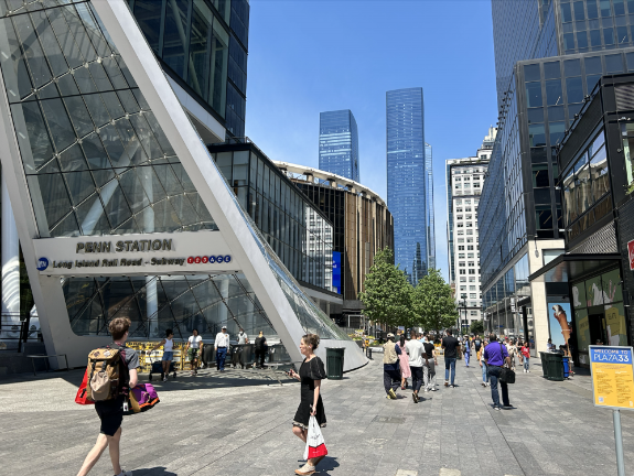 <b>Plaza33 features tables, chairs, and shade from trees to relax in the summer heat amid the bustle of Midtown. </b>