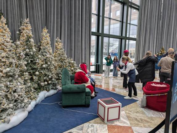 Parent captures photos of baby on Santa’s lap at Brookfield Place.