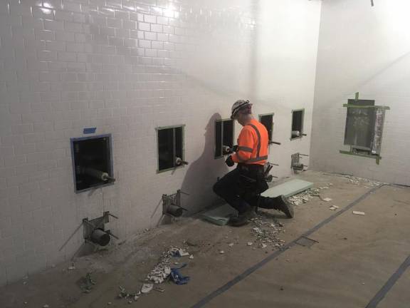 Plumbing installation in the Long Island Railroad concourse at Penn Station in 2019.