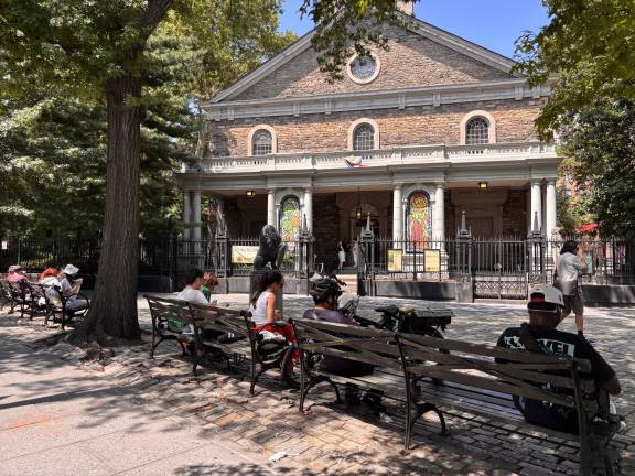 Visitors gather outside St. Mark’s Church in-the-Bowery on a Sunday. Church leaders say proceeds from a proposed transfer of development rights will help preserve the historic landmark while supporting its community programs.