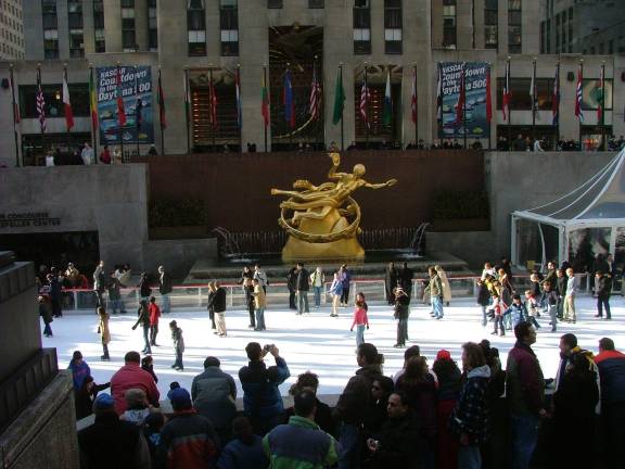Ice skaters revel at the Rockefeller Rink. It will reopen to the public on Oct. 11.
