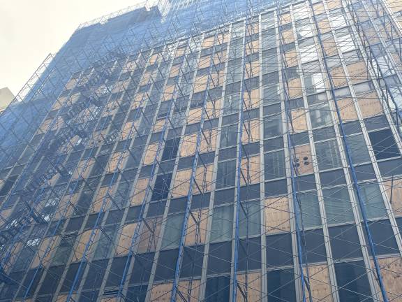 A closer look at the work done so far, including some window and wall panels being removed.