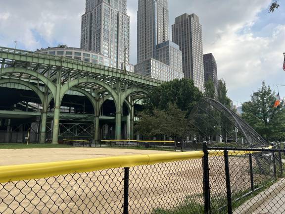 The 72nd Street Baseball Fields with the “Green Monster,” which is actually a portion of the elevated highway, in the background.