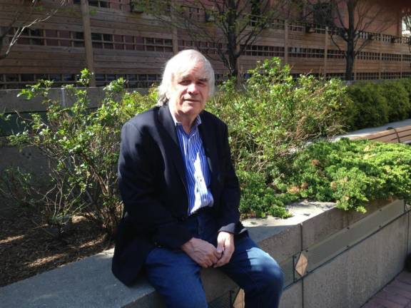 Mystery novelist R.G. Belsky, whose latest big-city newsroom thriller is Below the Fold, on a bench at 96th Street and Third Avenue on the Upper East Side.