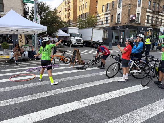 Summer Streets cyclist showing off her hula hoop skills.