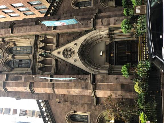 The historic 153-year-old St. John the Baptist Church on West 31st Street was one of many buildings that would have to be knocked down if a Penn Station rebuilding plan includes an expansion into the block south of the current station. Right now, any plans to demolish the block are on “absolute hold.”
