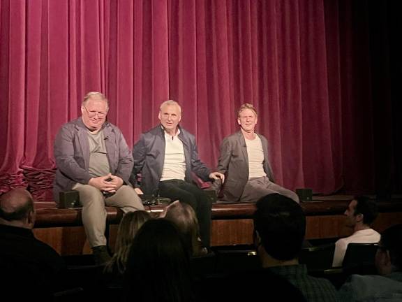 After a curtain malfunction, Phil Rosenthal (center, flanked by John Bedolis, the <i>Somebody Feed Phil </i>producer, left, and Richard Rosenthal, Phil’s brother, who is the showrunner and executive producer) answered questions from the diverse audience on June 17 at the 92NY. They all sat on the edge of the stage, unfazed when the curtain failed to rise.