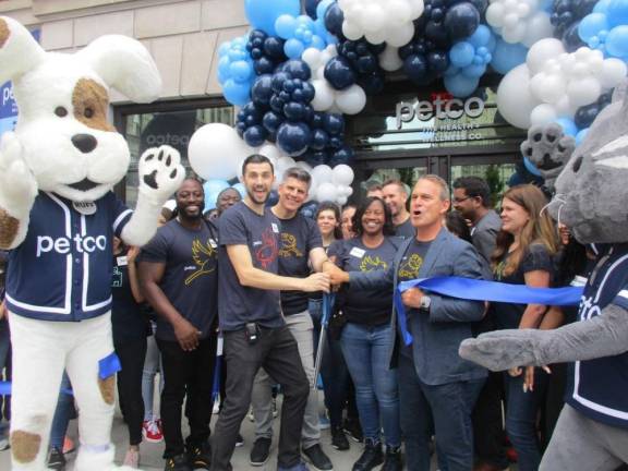 Once empty Tammany Hall is the scene of glittering ribbon cutting on June 4 accompanied by the company’s furry life sized mascot pets as it took over 33,000 sq. ft of the structure that was once the hub of Democratic power in the Big Apple. but there was still an undercurrent of unrest from unionized workers, particularly the carpenters union which had brought a different kind of animated pet, Scabby, union rat to the site during the construction to protest the company’s use of non-union labor. Photo: Mary Reinholz