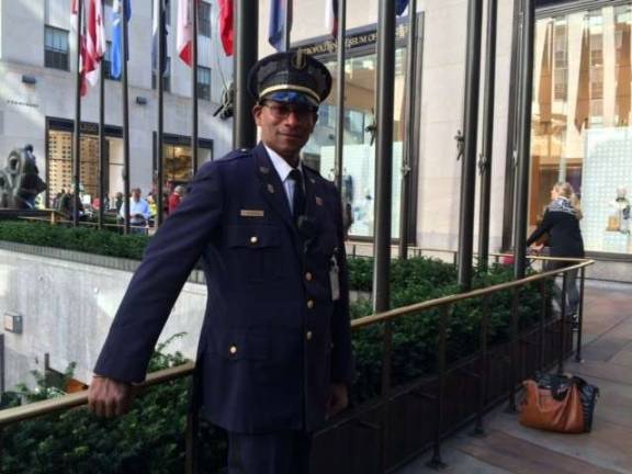 Pedro Francisco on duty at Rockefeller Center, where he saved a teenager. Photo: Genia Gould