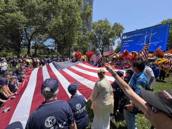 An American flag is unformed in Battery Park.