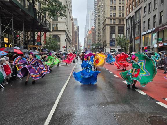 Folk dancers defy rain at Mexican Independence Day Parade on Madison Avenue, Sept. 20.