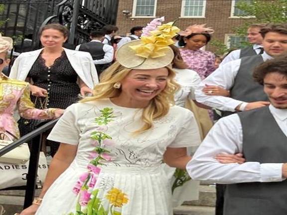Jewelry designer to the stars Blair Husain shares a laugh as she is escorted into the Hat Show in the Conservancy Garden in Central Park.