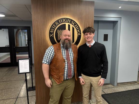 Xavier teacher William Maloney (left) was one of the best friends of fallen firefigher Patrick Brady who died in a fire in Brooklyn on Nov. 8. 2025. He said the article that student journalist Hudson Dew (right) wrote in the Xavier Review totally captured the essence of Brady, Class of 2001.