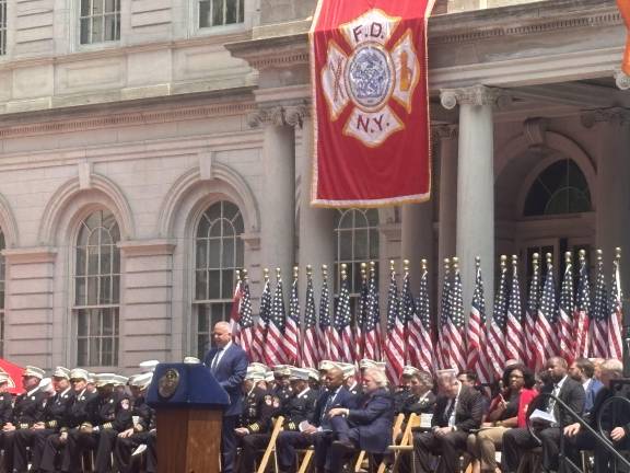 Fire Commissioner Robert S. Tucker opens the Medal Day ceremony at City Hall Park on June 4.