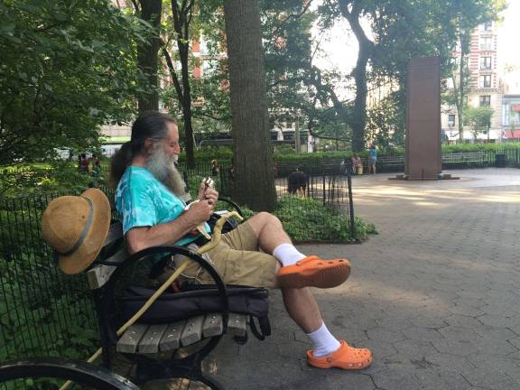 &quot;Mandola Joe&quot; Ornstein plays mandolin in Theodore Roosevelt Park. &quot;This has been a place where I have not only enjoyed the nature, but I taught myself to appreciate it in here,&quot; he said. Photo: Gabrielle Alfiero