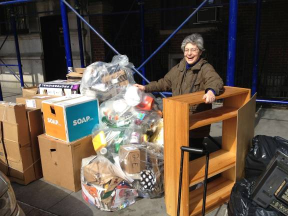 Jacquelyn Ottman hauling a bookcase she found on the street.