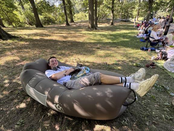 Owen Kolbrenner, in from Los Angeles for a summer internship, lounged on what he called “the most comfortable portable couch in the world” as he waited to get tickets on the opening weekend of Shakespeare in the Park at the newly renovated Delacorte Theater.
