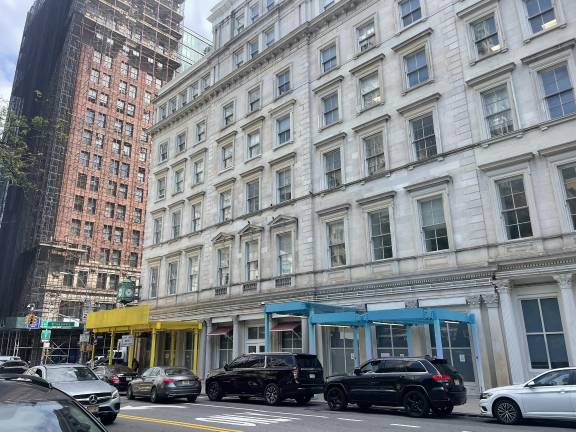 Prototypes for two of the six new scaffolding shed designs were installed in lower Manhattan as part of a citywide effort to rebrand street scaffolding.