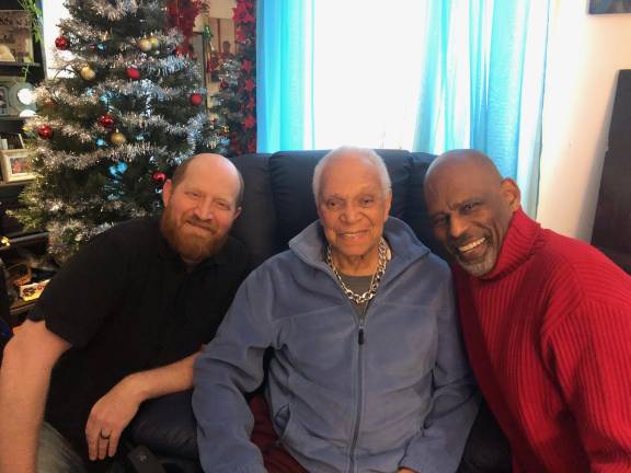 Team Nat: Nat Horne (c.) flanked by friends and former students, Benjamin Magnuson (l.) and Stanley Harrison (r.), just two members of the community responsible for creating and promoting the GoFundMe campaign to keep Horne at home.