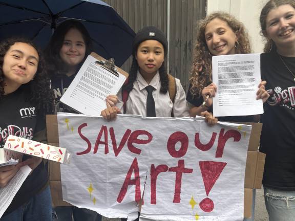 Middle School Students seek signatures to a petition to the Department of Education, urging the city restore the provider of its after school arts program. The DOE is switching from Manhattan Youth to another provider, irking parents