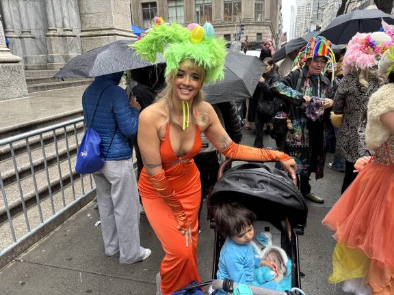 Easter eggs adorned Melissa Vento’s bonnet, while pushed her son in a stroller through the crowd of revelers.