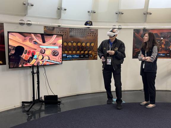 Former machinist’s mate, Stuart Gelband tries out the <i>Intrepid</i> Museum’s new VR engine room experience. “That was fun,” Gelband said. “I enjoyed the heck out of it.”