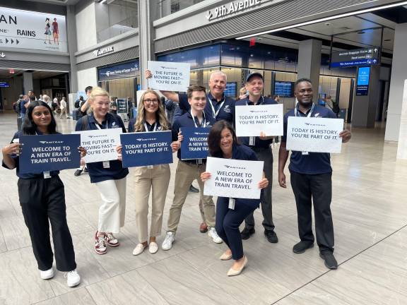 Placard-carrying Amtrak staffers walked through the Moynihan Train Hall/Penn Station, noting the historical moments on Aug. 28.