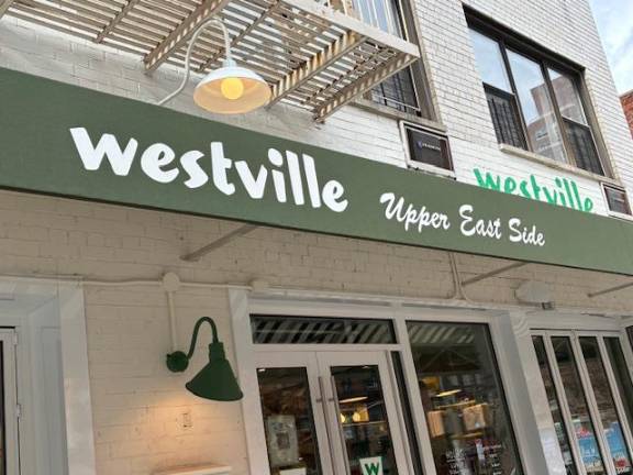 The green Westville awning, with ‘Upper East Side’ scrawled specifically for the neighborhood.