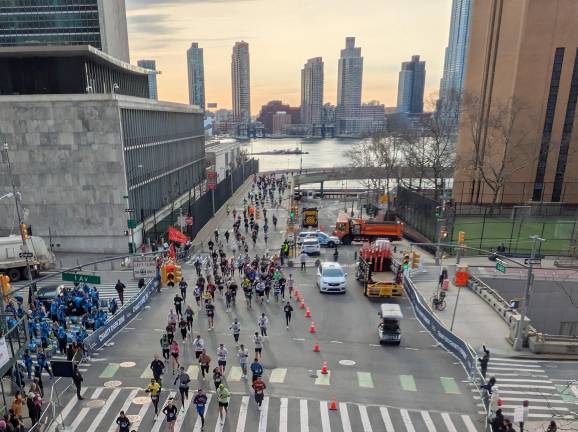 NYC Half Marathon runners coming off FDR Drive onto 42nd Street.
